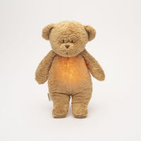 Moonie – ourson nature bio avec sons & lumières caramel - Mode Bébé Claye
