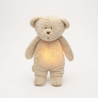 Moonie – ourson nature bio avec sons & lumières sable - Mode Bébé Claye