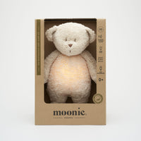 Moonie – ourson nature bio avec sons & lumières sable - Mode Bébé Claye
